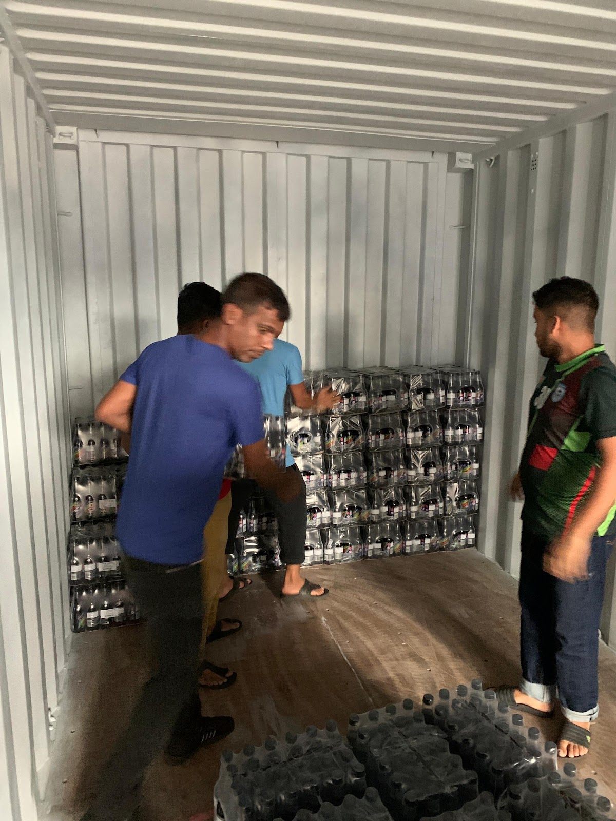 Loading palletised goods into a shipping container for export