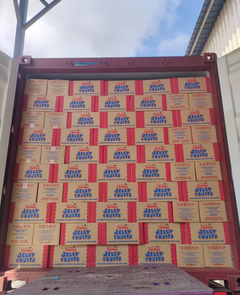 Toppie Jelly Fruits private-label cartons packed inside a shipping container for export
